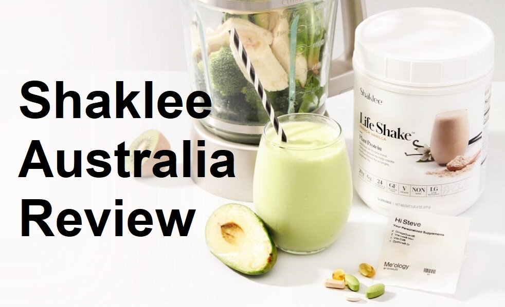 Shaklee Australia Review banner with a green smoothie, blender, avocado half, and Life Shake protein container on a white surface.
