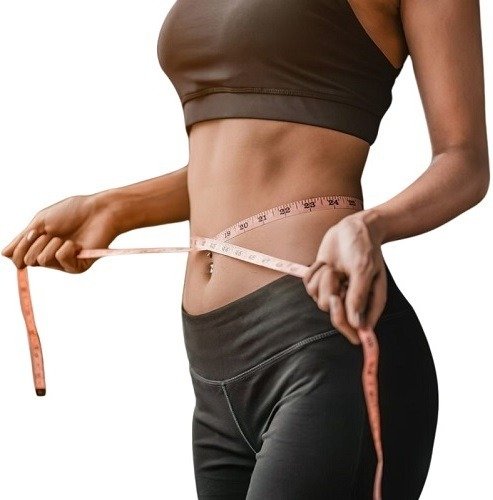 Shaklee Modere Weight Loss - Lean Body System - TRIM BURN ACTIVATE - Shop Shaklee Australia Woman measuring her waist with a pink tape measure while wearing a brown sports bra and black leggings at the gym/fitness setting.